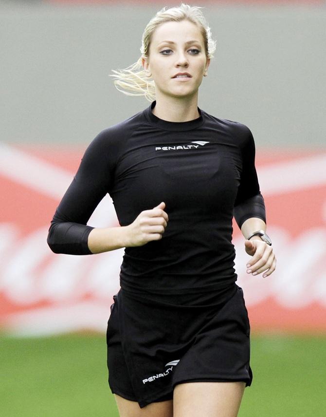 Brazil's referee assistant Fernanda Colombo Uliana warms up before the Brazilian championship soccer match.