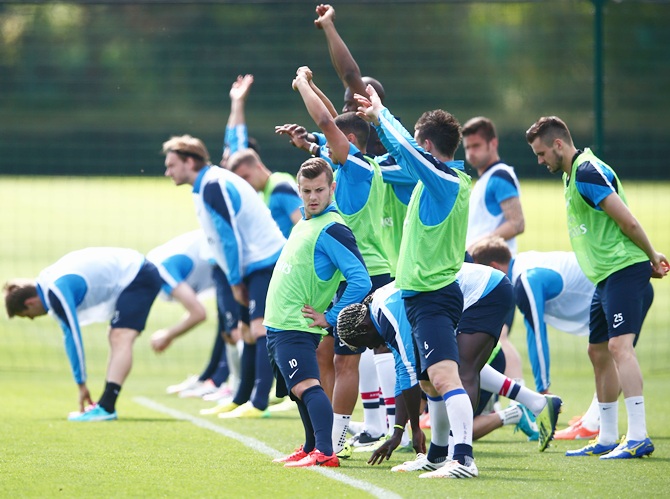 Jack Wilshere of Arsenal stretches during a training session