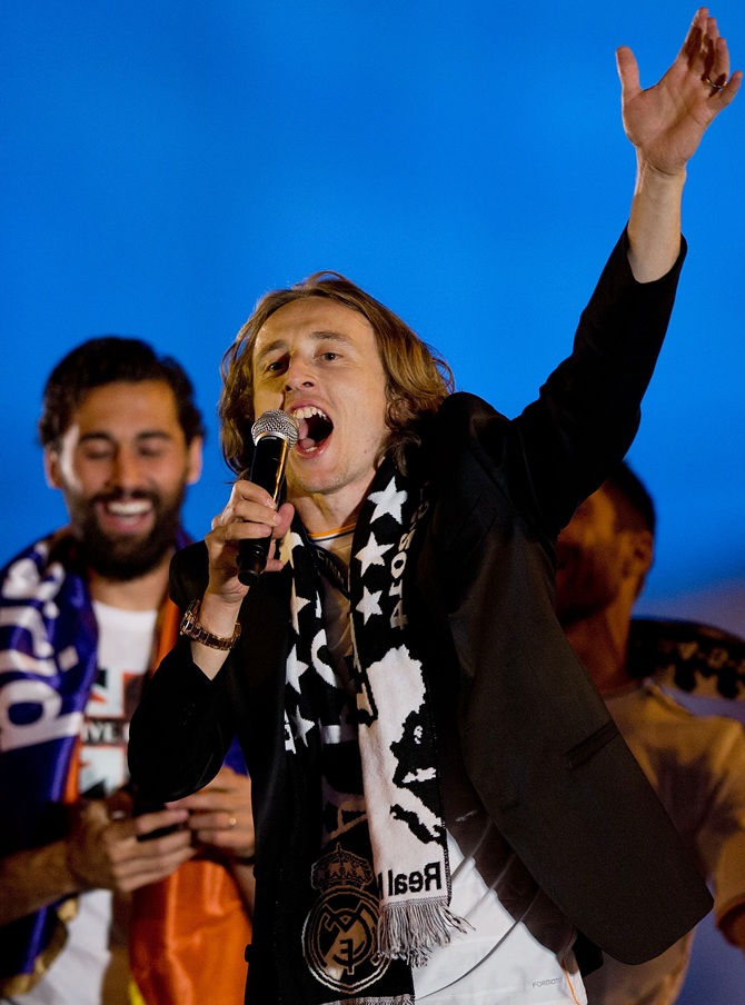 Luka Modric of Real Madrid CF greets the audience during the celebration of their victory