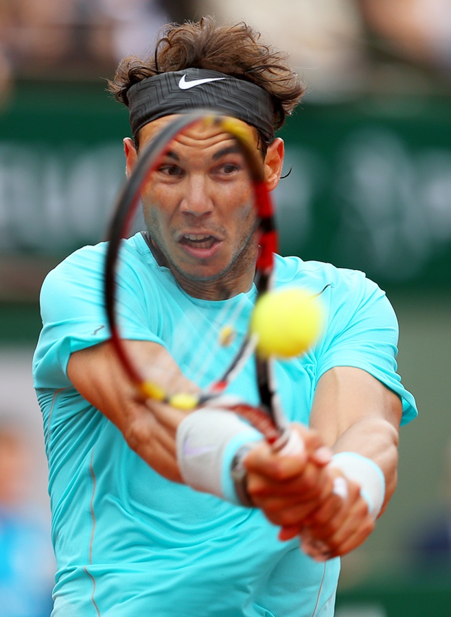 Rafael Nadal of Spain returns a shot