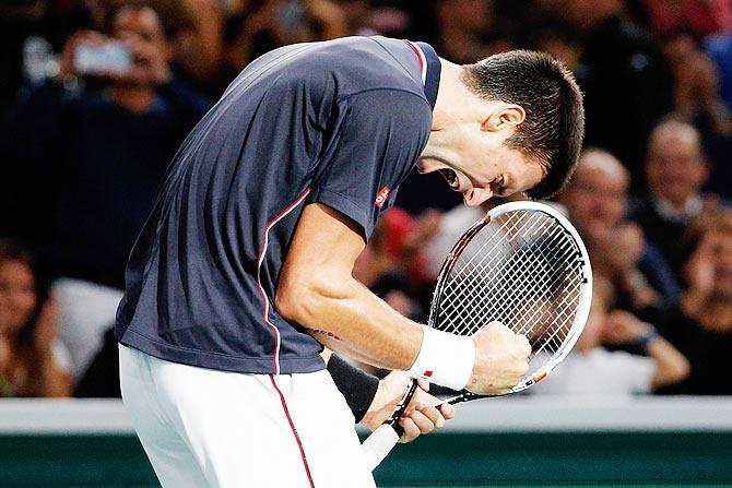 Novak Djokovic of Serbia celebrates 