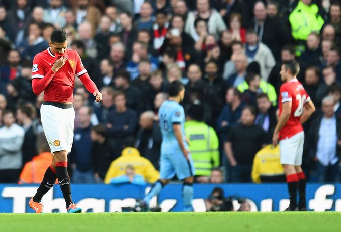 Chris Smalling of Manchester United leaves the field after receiving a red card on Sunday