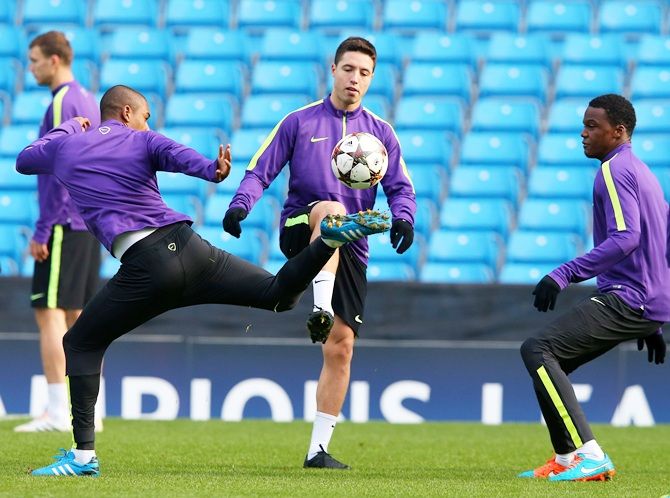Samir Nasri of Manchester City passes the ball 