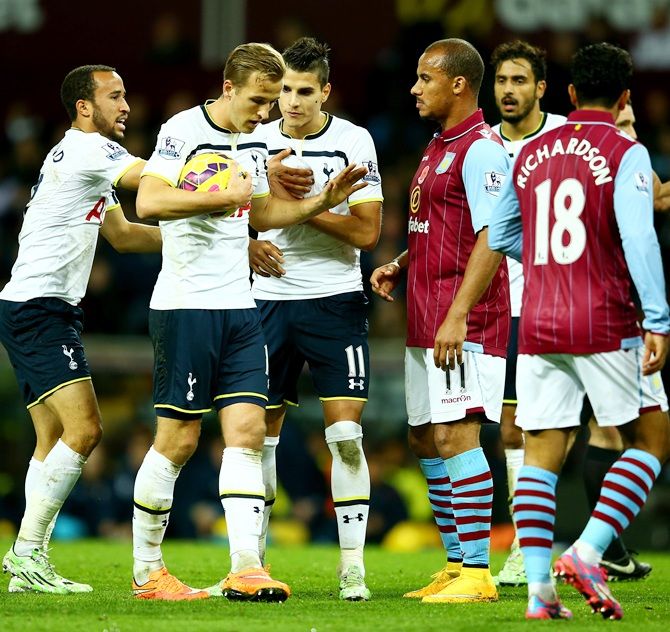 Harry Kane of Spurs keeps hold of the ball 