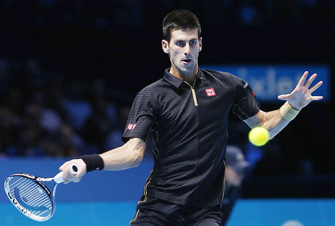 Novak Djokovic plays a return against Stanislas Wawrinka