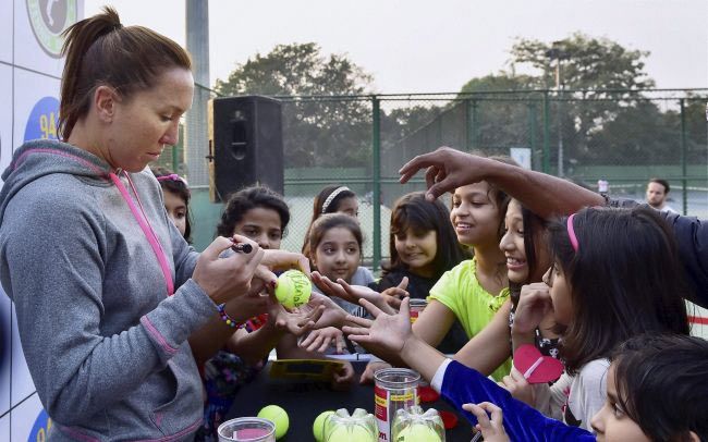 Jelena Jankovic signs tennis balls for fans at the DLTA