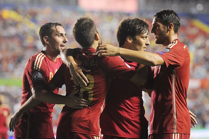 Spain' David Silva (2nd from right) of Spain celebrates with Jordi Alba after scoring during their UEFA EURO 2016 Group C Qualifier against Macedonia at Estadio Ciutat de Valencia on September 8