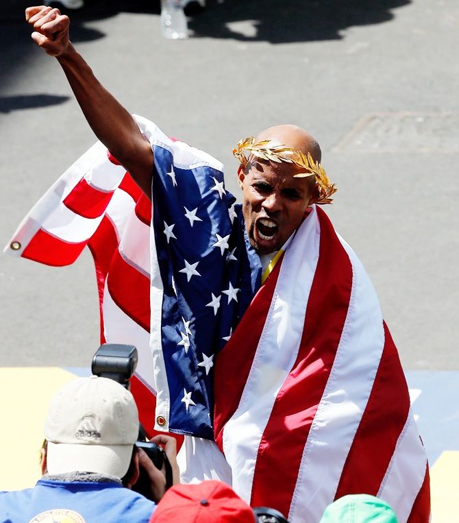 Meb Keflezighi of the United States celebrates after winning the 118th Boston Marathon