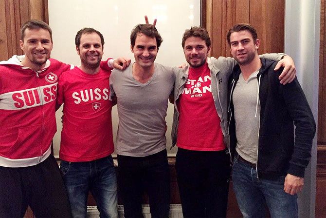 Roger Federer and Wawrinka with the Switzerland team during before a training session in France on Monday
