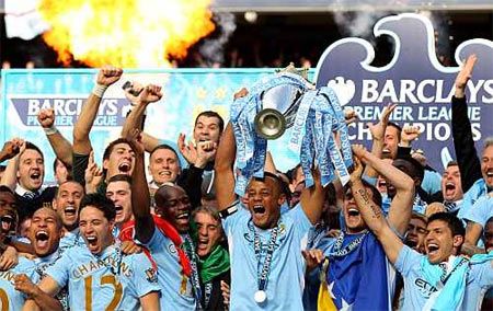 Manchester City players celebrate winning the English Premier League
