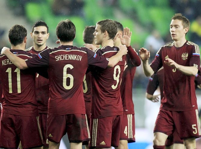  Russia's Aleksandr Kerzhakov, second left, celebrates with team mates