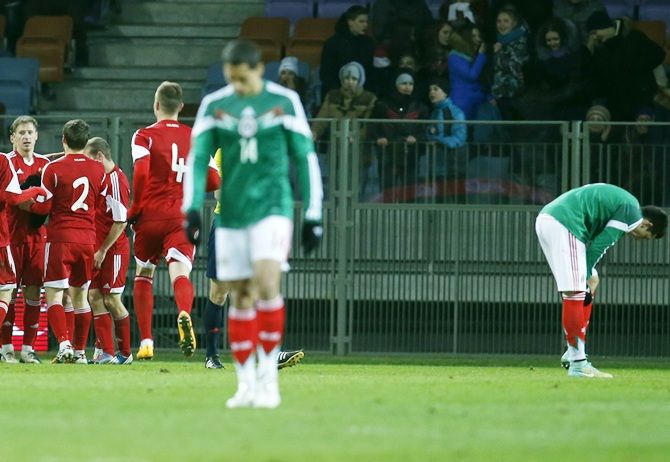 Belarus' players celebrate after scoring a goal during their international friendly match against Mexico