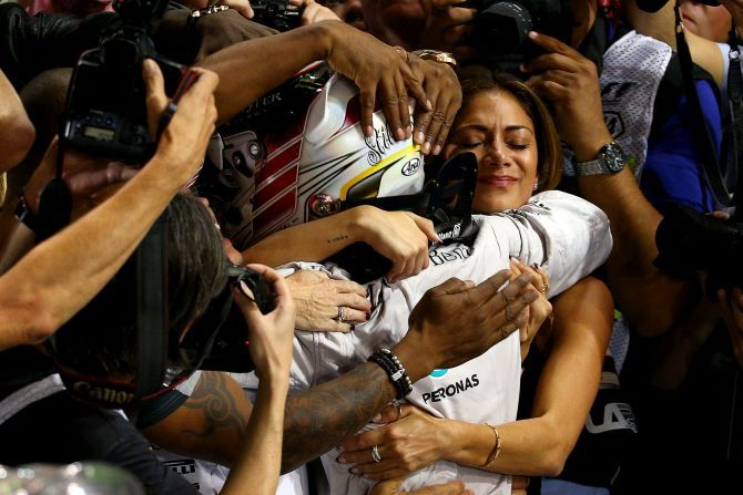 Lewis Hamilton of Great Britain and Mercedes GP celebrates with girlfriend Nicole Scherzinger