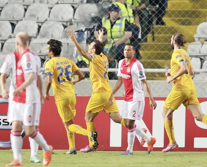 APOEL Nicosia's Gustavo Manduca, centre, celebrates
