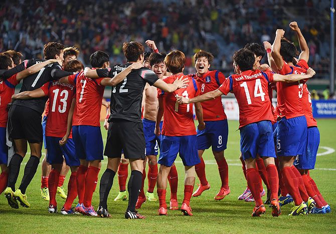 South Korea players celebrate after claiming the Football Men's Gold Medal match against North Korea at Munhak Stadium in Incheon on Thursday