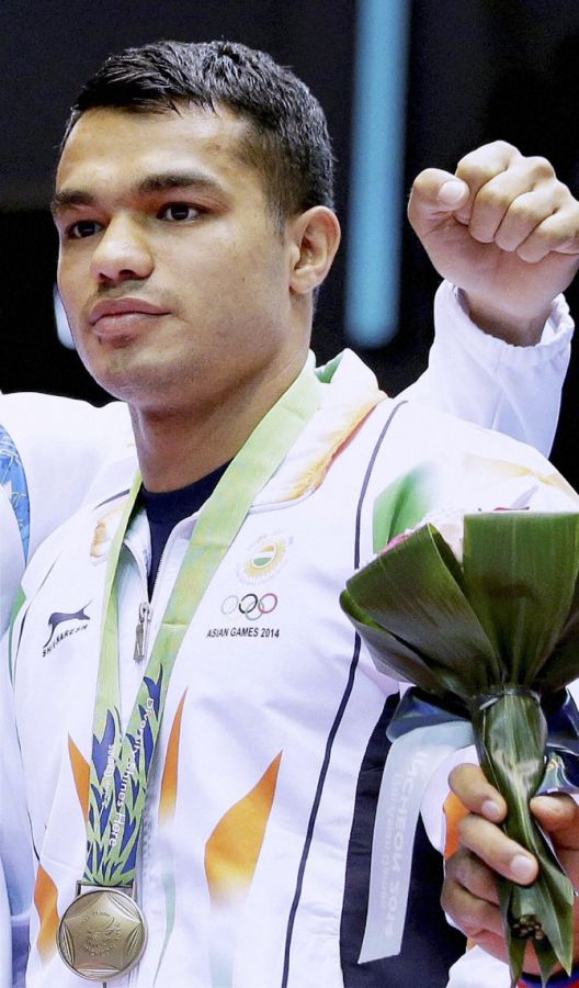 Bronze medal winner Indias Vikas Krishhan at the medal ceremony for the men's middle weight boxing at the 17th Asian Games in Incheon on Friday.