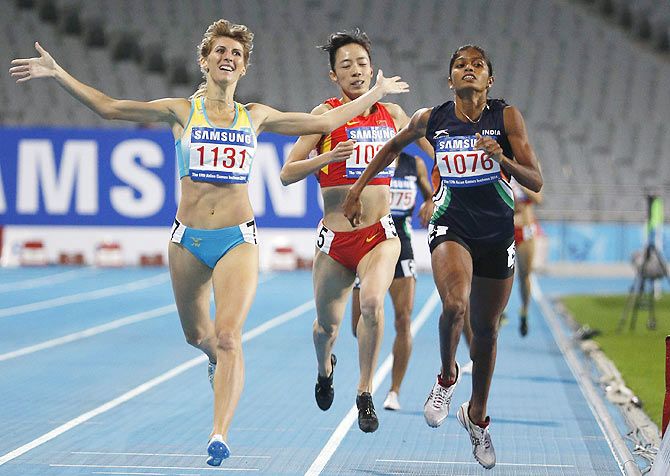 Kazakhstan's Margarita Mukasheva (left) celebrates crossing the line ahead of India's Tintu Luka (right) and China's Zhao Jing in the women's 800m final at the Incheon Asiad Main Stadium during the 17th Asian Games on Wednesday.