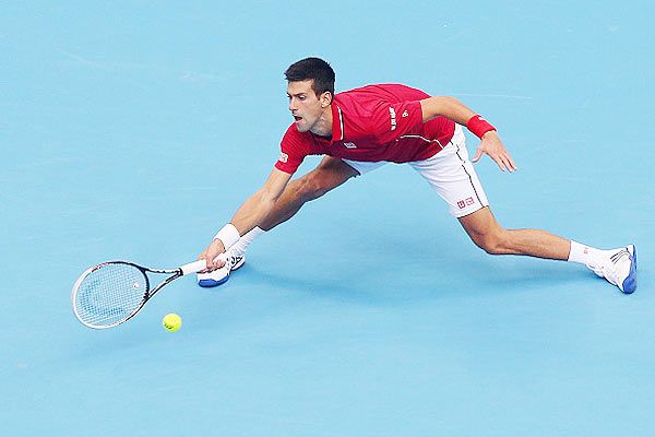 Novak Djokovic of Serbia plays a forehand in his semifinal match against Andy Murray of Great Britain during day eight of the China Open 