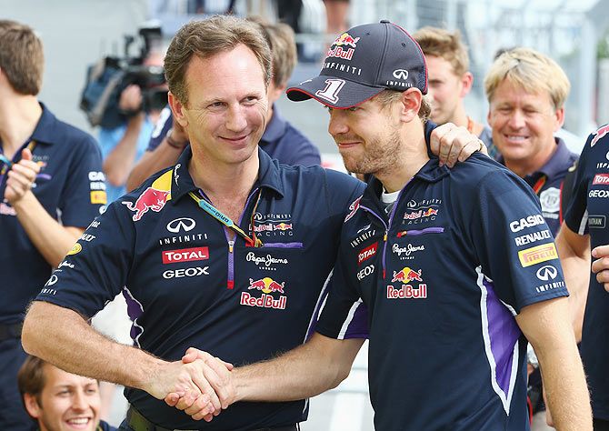 Sebastian Vettel (right) with Infiniti Red Bull Racing Team Principal Christian Horner 
