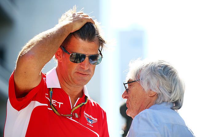 F1 supremo Bernie Ecclestone (right) speaks with Graeme Lowdon, President and Sporting Director of Marussia in the paddock during previews ahead of the Russian Formula One Grand Prix at Sochi Autodrom on Thursday