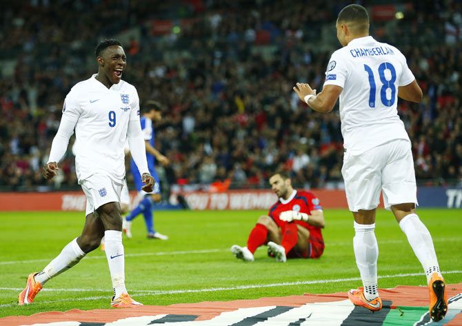 England's Danny Welbeck (left) celebrates with Alex Oxlade-Chamberlain after scoring his team's third goal against San Marino during their Euro 2016 qualifying match at Wembley Stadium in London on Thursday