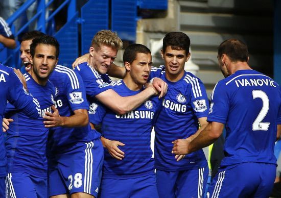 Chelsea's Eden Hazard (centre) celebrates with teammates after scoring a penalty against Arsenal