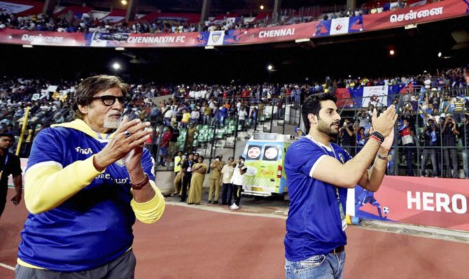 Chennaiyin FC co owner Abhishek Bachchan (right) and Amitabh Bachchan celebrate after Indian Super League match between Chennaiyin FC and Kerala Blasters FC in Chennai on Tuesday