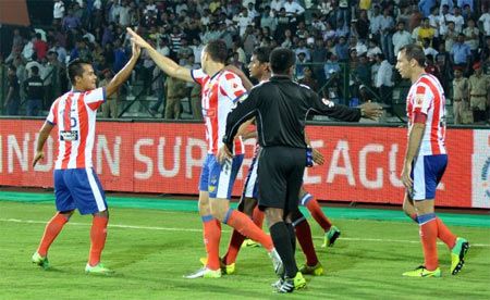 Atletico de Kolkata players celebrate a goal