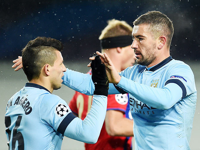 Sergio Aguero (left) and Aleksandar Kolarov of Manchester City FC celebrate after scoring 