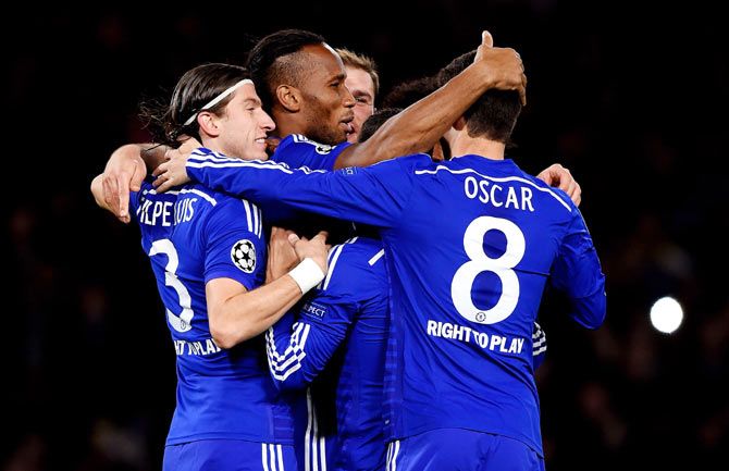 Didier Drogba (centre) of Chelsea celebrates with teammates after scoring