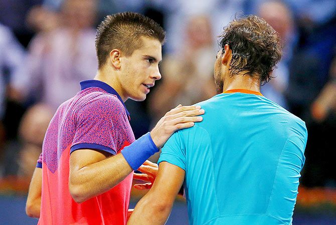 Borna Coric of Croatia is congratulated by Spain's Rafael Nadal (right) after winning at the Swiss Indoors ATP tennis tournament in Basel on Friday
