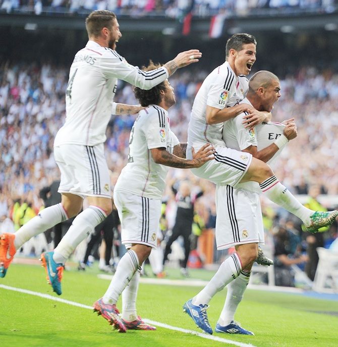 Pepe of Real Madrid CF celebrates with James Rodriguez