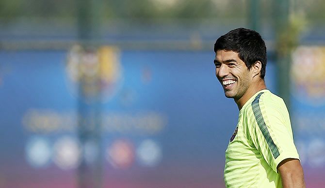 Barcelona's players Luis Suarez smiles during a training session