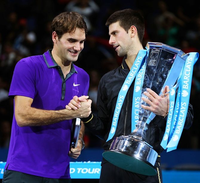 Novak Djokovic of Serbia shakes hands with Roger Federer of Switzerland