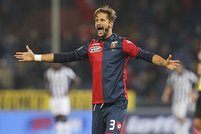 Luca Antonini of Genoa CFC celebrates after scoring the opening goal during the Serie A match between Genoa CFC and Juventus FC