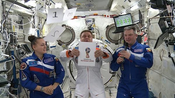 Russian cosmonauts reveal the official 2018 FIFA World Cup logo on Tuesday