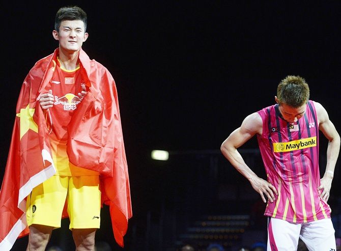 China's Chen Long, left, celebrates after winning the men's singles final against Malaysia's Lee Chong Wei