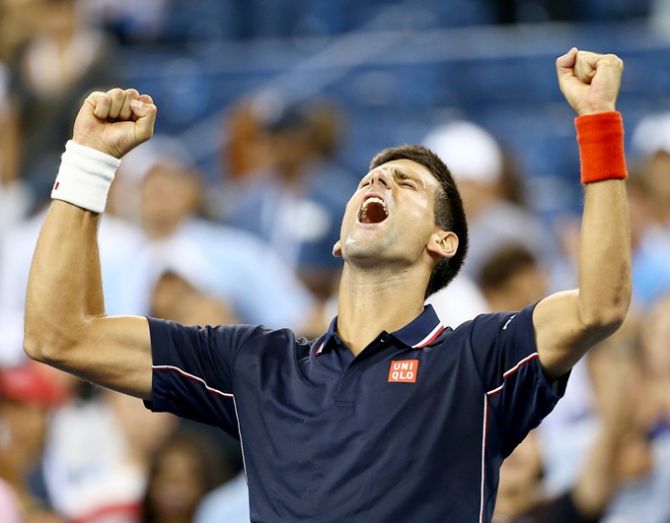 Novak Djokovic of Serbia celebrates after defeating Andy Murray of Great Britain