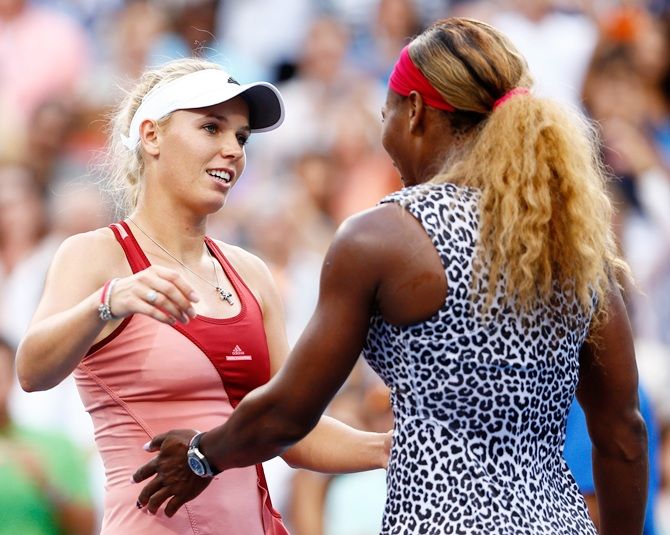 Serena Williams of the United States hugs Caroline Wozniacki of Denmark