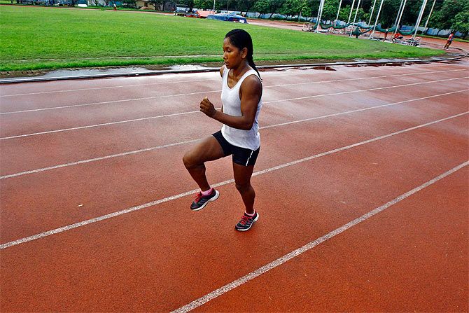 Heptathlete Swapna Barman runs during a practice session at Salt Lake stadium in Kolkata August 