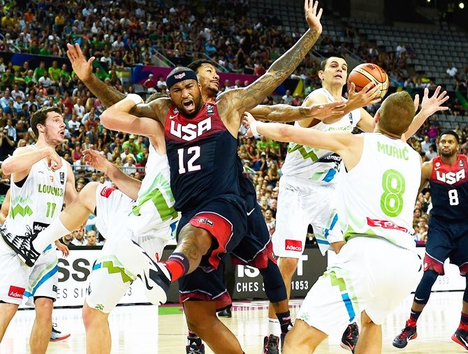 DeMarcus Cousins of the USA Basketball Men's National Team duels for the ball   with Slovenia Basketball Men's National Team players