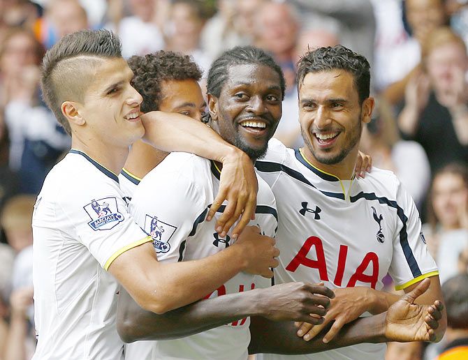 Tottenham Hotspur's Emmanuel Adebayor (centre) celebrates with teammates after scoring a goal against Queens Park Rangers