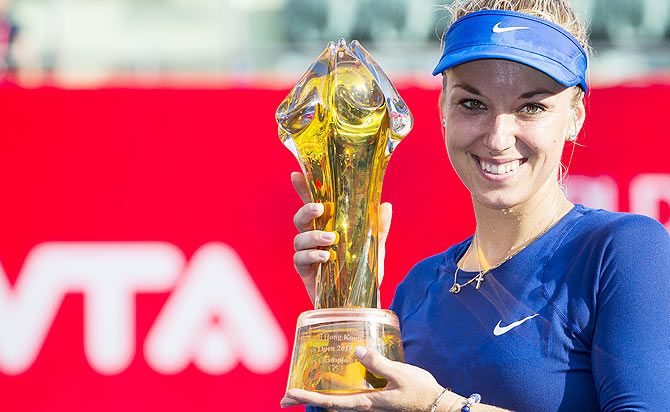 Sabine Lisicki of Germany poses with the trophy after winning the Hong Kong Tennis Open against Karolina Pliskova of Czech Republic