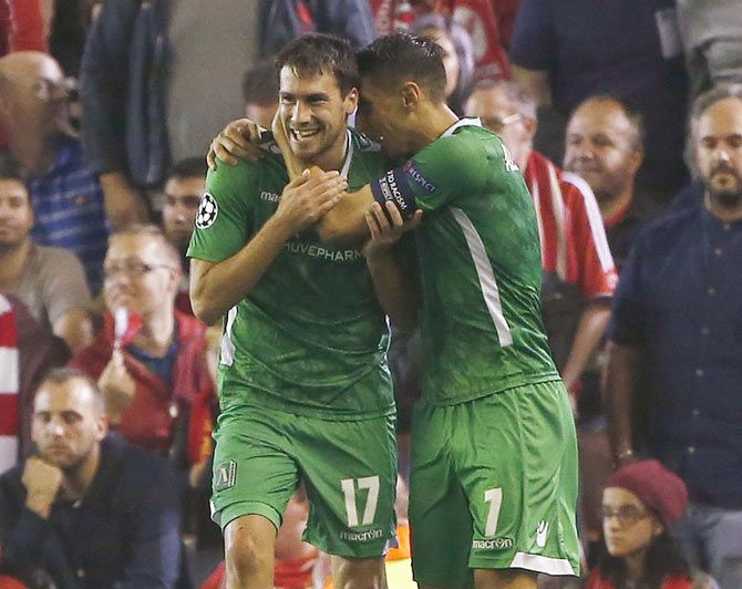 Ludogorets' Dani Abalo (left) celebrates with teammate Mihail Aleksandrov after scoring a goal against Liverpool 