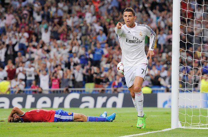 Cristiano Ronaldo of Real Madrid celebrates after scoring Real's 3rd goal during the UEFA Champions League Group B match between Real Madrid CF and FC Basel 1893