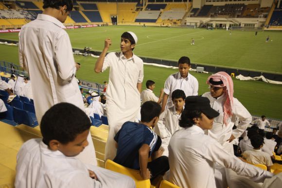 Young football fans at a stadium in Qatar
