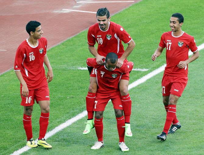 Laith Subhi Drzi Albashtawi of Jordan celebrates with his teammates after scoring against India during the Football Mens Group G match on day three of the 2014 Asian Games at Munhak Stadium in Incheon on Monday