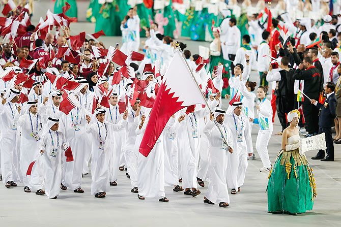 Mubarak Ali Al Morekhe of Qatar carries the country flag during the Opening Ceremony ahead of the 2014 Asian Games at Incheon Asiad Stadium on September 19, 2014