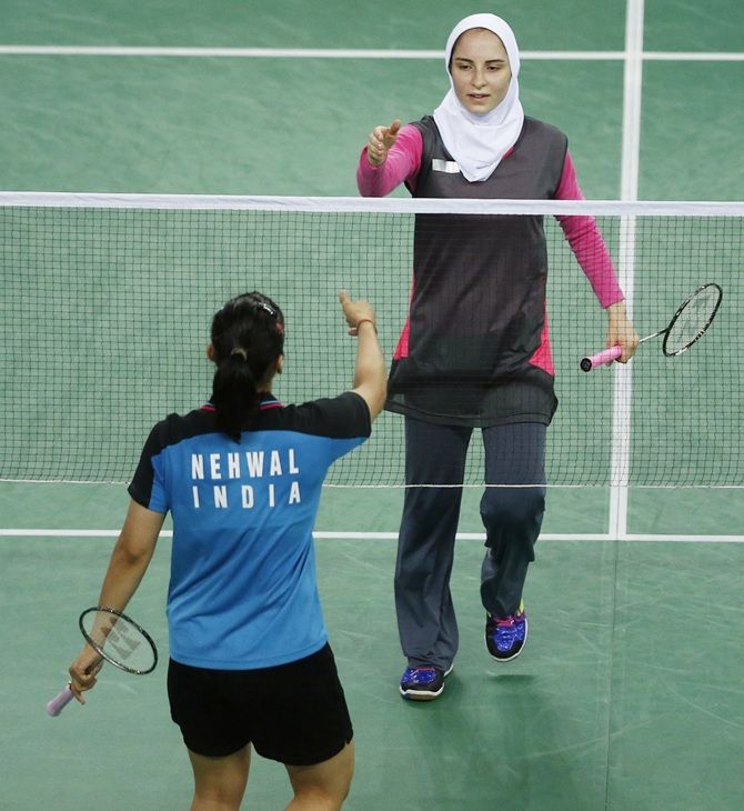 Iran's Aghaei Hajiagha Soraya, right, shakes hands after losing to India's Saina Nehwal
