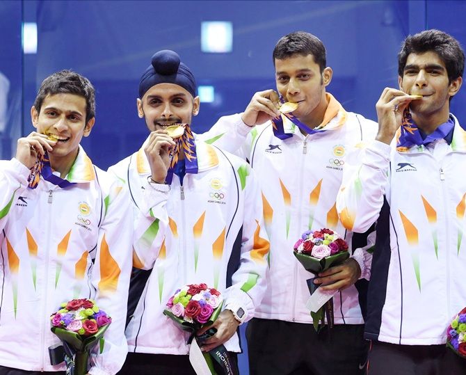 Gold medal winners India's Saurav Ghosal, Harinder Pal Singh Sandhu, Kush Kuamr and Mahesh Manaonkar during the medal ceremony of Men squash team event at Yeorumul Squash Court on Saturday. 